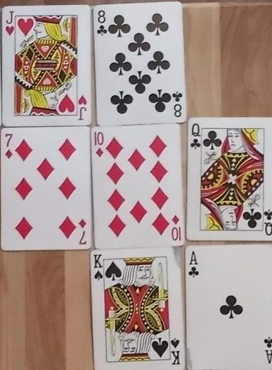 A 2x2 grid of cards made up of a Jack, a 10, a 7, and an 8 for use as evidence in the Cartes Noires exercise